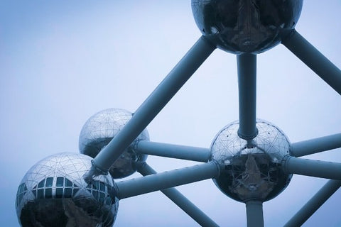 Metallic atomic sculpture, reflecting geometric patterns.